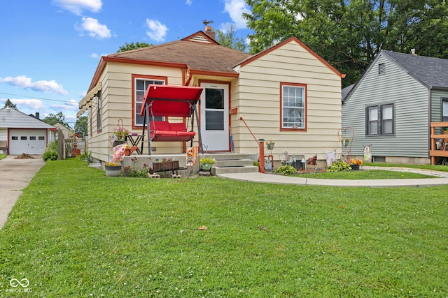 2017 E Legrande Ave, Indianapolis, IN 46203 - bungalow-style house featuring entry steps, an outdoor structure, a front yard, and a detached garage
