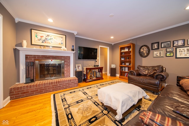 7224 N Tuxedo St, Indianapolis, IN 46240 - living room with wood finished floors, crown molding, a brick fireplace, and recessed lighting