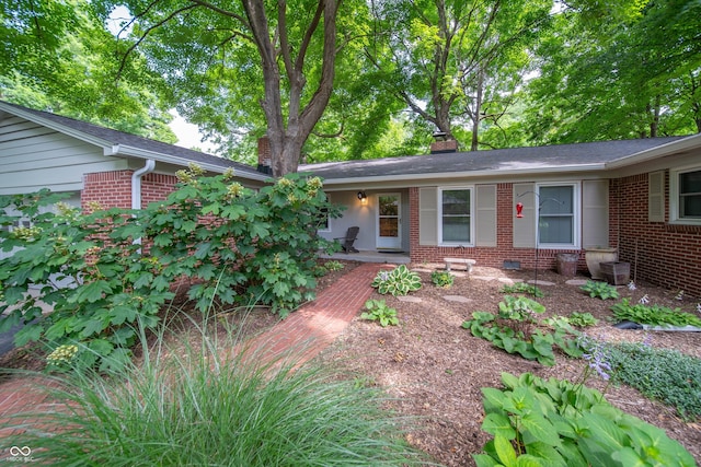 7224 N Tuxedo St, Indianapolis, IN 46240 - view of front of property with brick siding and a chimney