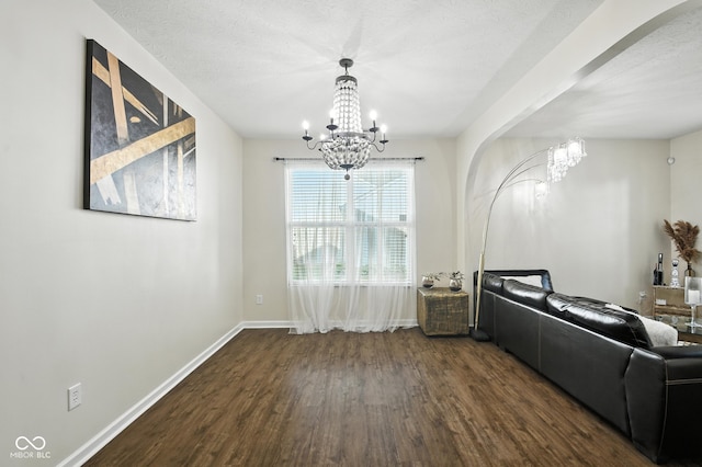 5664 Crump Ln, Indianapolis, IN 46234 - dining room featuring a chandelier, dark wood-style flooring, and arched walkways