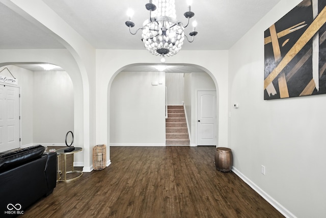 5664 Crump Ln, Indianapolis, IN 46234 - dining area featuring arched walkways, wood finished floors, stairs, and a chandelier