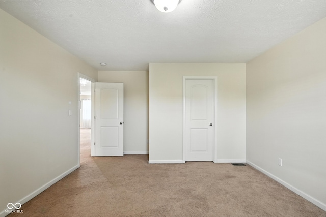5664 Crump Ln, Indianapolis, IN 46234 - unfurnished bedroom featuring carpet flooring and a textured ceiling