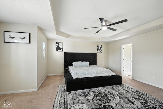 5664 Crump Ln, Indianapolis, IN 46234 - bedroom with light colored carpet, a tray ceiling, and a ceiling fan