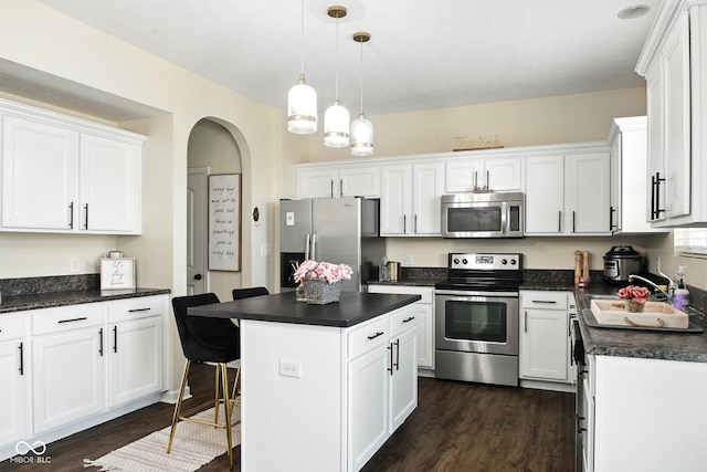 5664 Crump Ln, Indianapolis, IN 46234 - kitchen featuring stainless steel appliances, dark countertops, and dark wood-style flooring