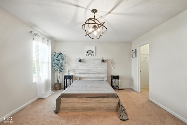 5664 Crump Ln, Indianapolis, IN 46234 - bedroom with light colored carpet and a walk in closet