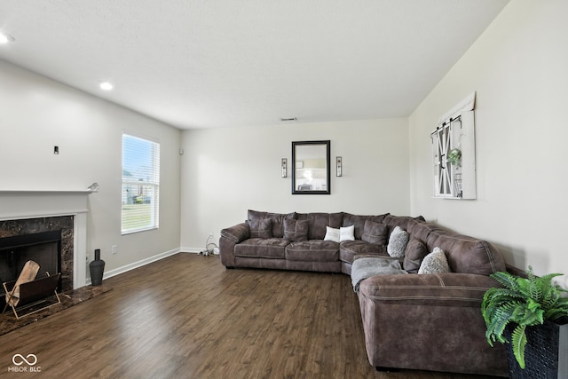 5664 Crump Ln, Indianapolis, IN 46234 - living room featuring dark wood-style flooring, a high end fireplace, and recessed lighting