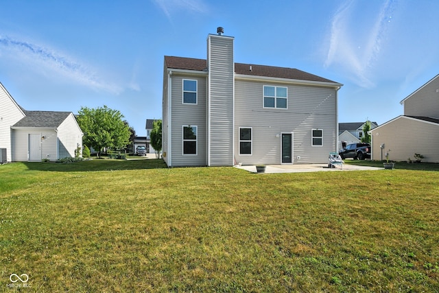 5664 Crump Ln, Indianapolis, IN 46234 - rear view of property with a patio area, a lawn, and a chimney