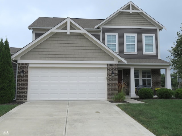 2272 Trefoil Dr, Plainfield, IN 46168 - view of front facade with brick siding, concrete driveway, a porch, roof with shingles, and a garage