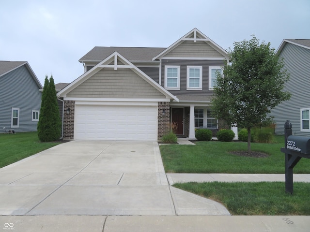 2272 Trefoil Dr, Plainfield, IN 46168 - view of front of house featuring brick siding, a front yard, driveway, and an attached garage