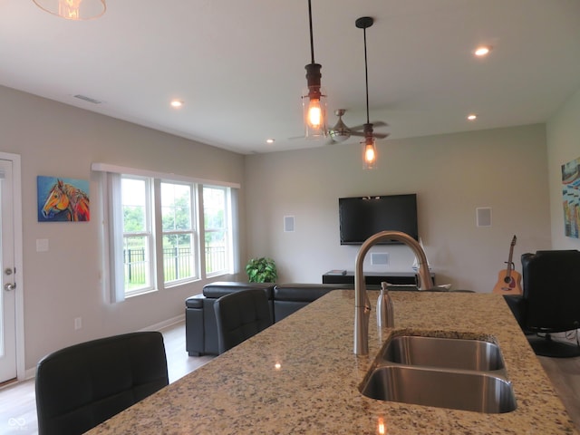 2272 Trefoil Dr, Plainfield, IN 46168 - kitchen with open floor plan, pendant lighting, light stone countertops, recessed lighting, and a ceiling fan