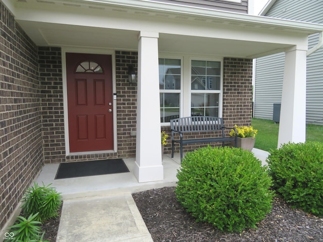 2272 Trefoil Dr, Plainfield, IN 46168 - doorway to property with covered porch and brick siding