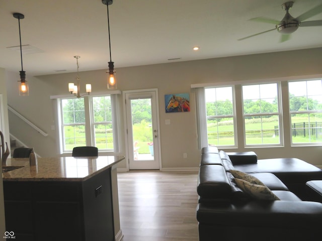 2272 Trefoil Dr, Plainfield, IN 46168 - living room featuring healthy amount of natural light, light wood-type flooring, stairs, recessed lighting, and ceiling fan