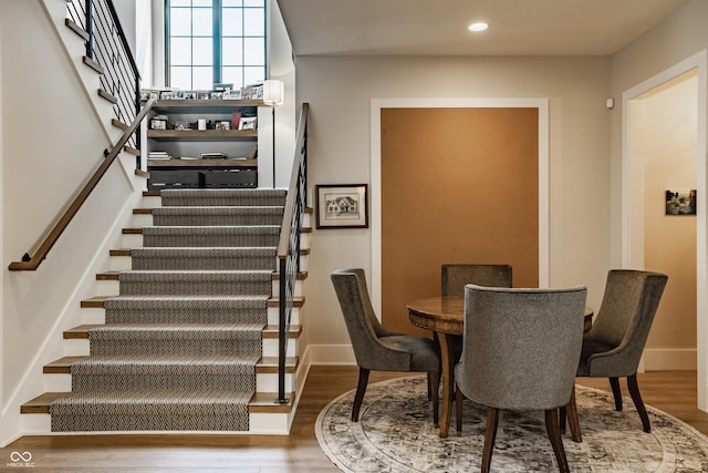 12022 Otto Ln, Carmel, IN 46032 - dining area with stairway, wood finished floors, and recessed lighting