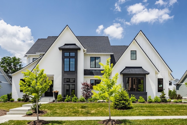 12022 Otto Ln, Carmel, IN 46032 - modern farmhouse style home featuring board and batten siding, a standing seam roof, roof with shingles, and a front yard