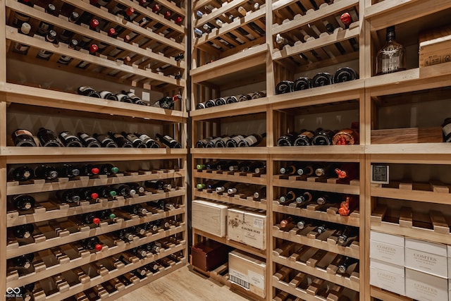 12022 Otto Ln, Carmel, IN 46032 - wine room with wood finished floors