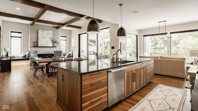 12022 Otto Ln, Carmel, IN 46032 - kitchen featuring open floor plan, stainless steel dishwasher, dark countertops, coffered ceiling, and beam ceiling