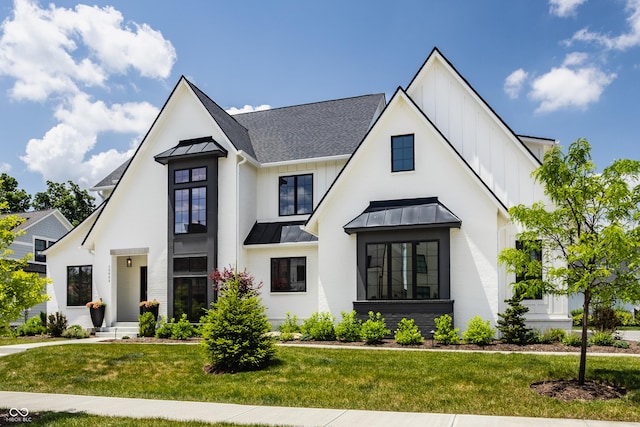 12022 Otto Ln, Carmel, IN 46032 - modern farmhouse style home with board and batten siding, a standing seam roof, and a front lawn