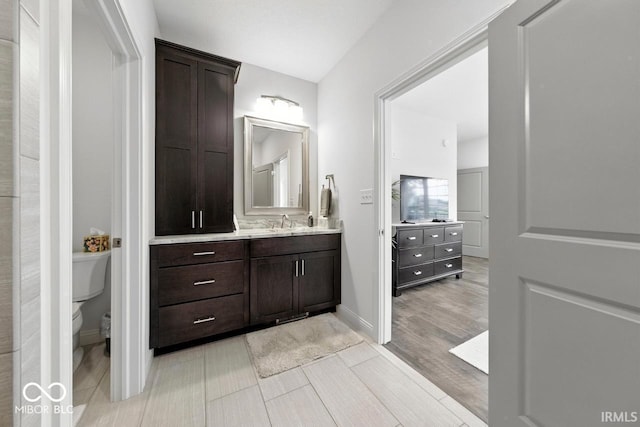 4909 N Graystone Dr, Muncie, IN 47304 - bathroom with vanity and wood finished floors