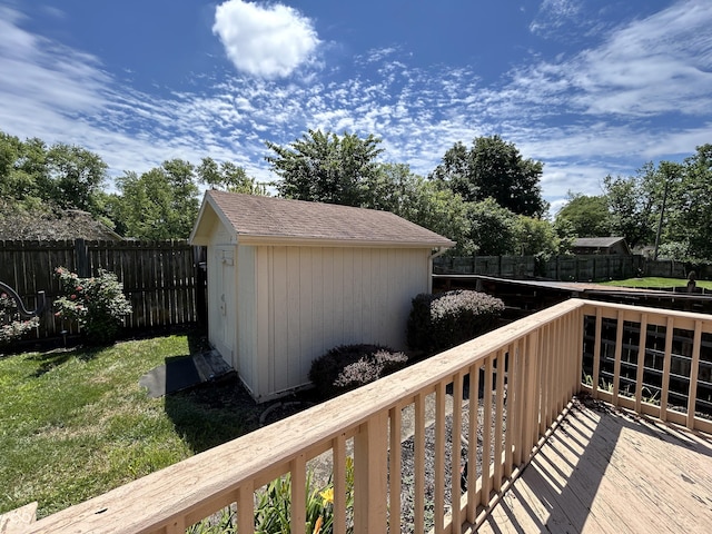 4675 N Riverside Dr, Columbus, IN 47203 - wooden deck featuring a storage unit and a fenced backyard