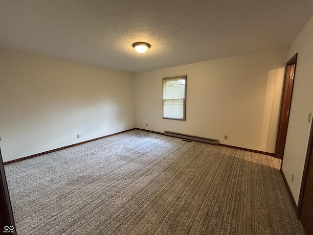 4675 N Riverside Dr, Columbus, IN 47203 - carpeted spare room with a baseboard heating unit and baseboards