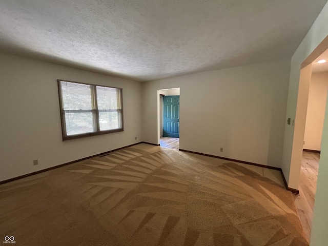 4675 N Riverside Dr, Columbus, IN 47203 - empty room with light carpet and a textured ceiling