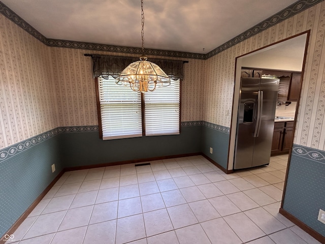 4675 N Riverside Dr, Columbus, IN 47203 - unfurnished dining area with a chandelier and light tile patterned flooring