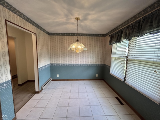 4675 N Riverside Dr, Columbus, IN 47203 - unfurnished dining area featuring a baseboard radiator, a chandelier, and wallpapered walls
