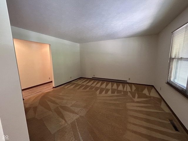 4675 N Riverside Dr, Columbus, IN 47203 - unfurnished room featuring baseboard heating and light carpet