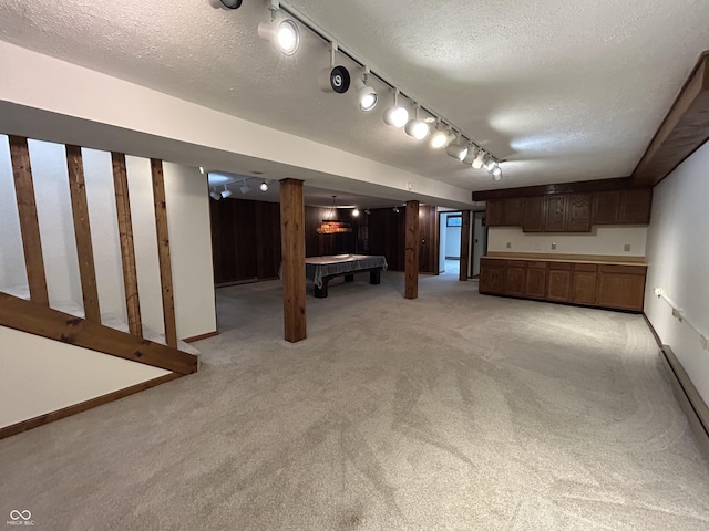 4675 N Riverside Dr, Columbus, IN 47203 - finished basement featuring light carpet, billiards table, a textured ceiling, and track lighting