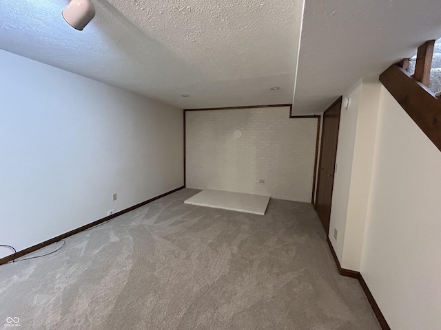 4675 N Riverside Dr, Columbus, IN 47203 - basement with light colored carpet and a textured ceiling