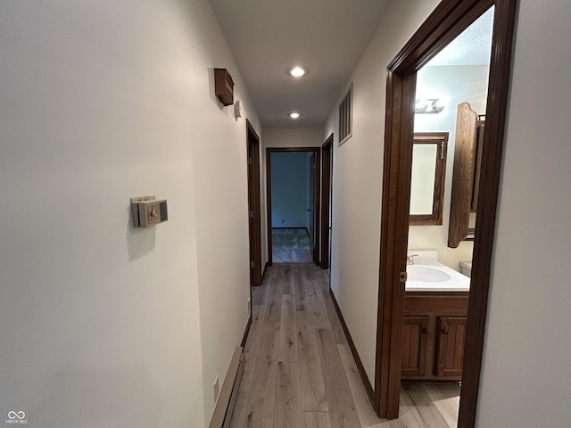 4675 N Riverside Dr, Columbus, IN 47203 - corridor with light wood finished floors and recessed lighting