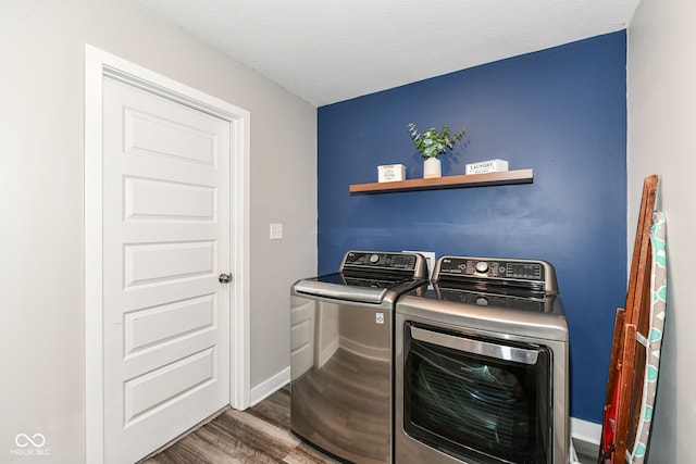 16502 Dominion Dr, Fishers, IN 46040 - laundry area with washer and dryer, wood finished floors, and a textured ceiling