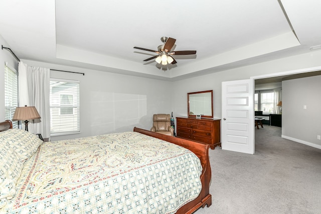 16502 Dominion Dr, Fishers, IN 46040 - bedroom featuring a tray ceiling, carpet floors, and a ceiling fan