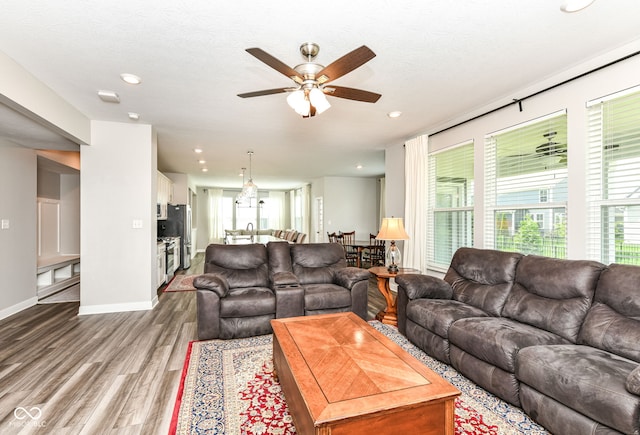 16502 Dominion Dr, Fishers, IN 46040 - living room featuring wood finished floors, ceiling fan, and recessed lighting