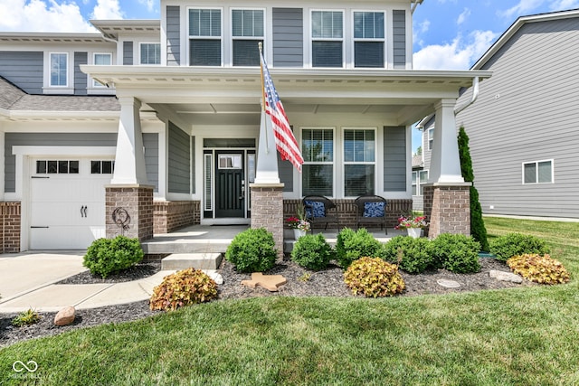16502 Dominion Dr, Fishers, IN 46040 - view of front facade with a porch, a garage, concrete driveway, and a front lawn