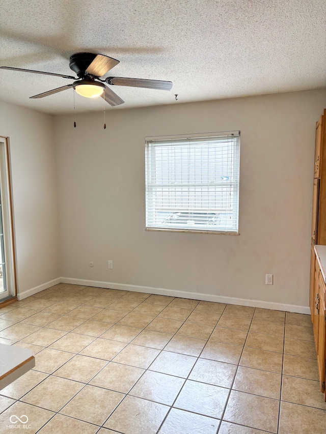 2770 Two Worlds Dr, Columbus, IN 47201 - unfurnished room with a textured ceiling, ceiling fan, and light tile patterned flooring