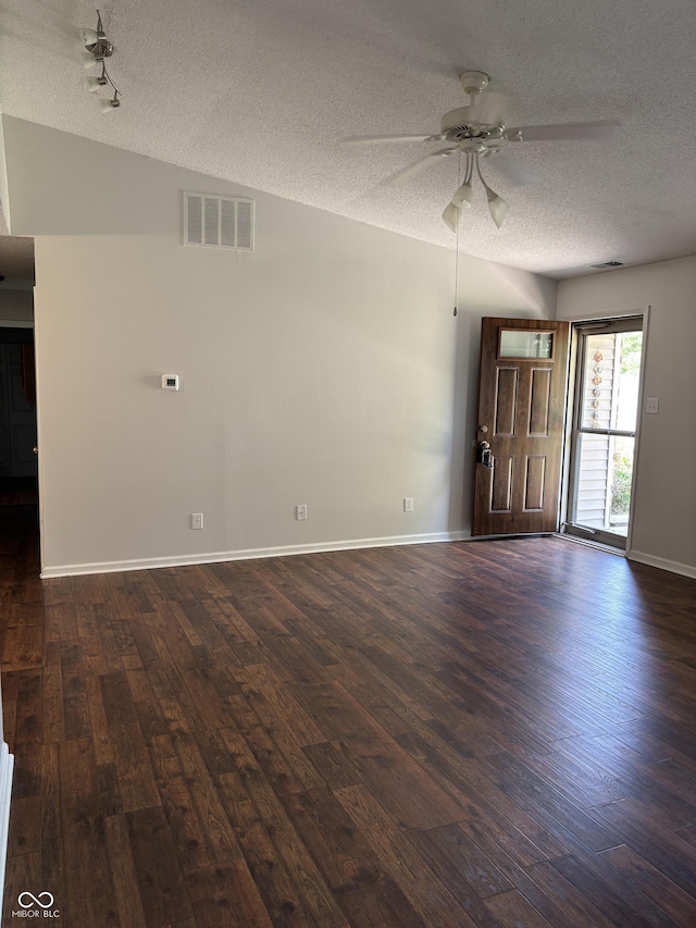 2770 Two Worlds Dr, Columbus, IN 47201 - unfurnished living room featuring a textured ceiling, a ceiling fan, and dark wood-style floors