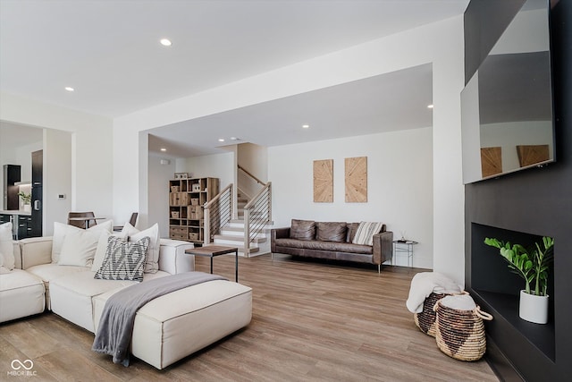 1269 Chatham Rdg Ct, Westfield, IN 46074 - living room featuring light wood-style floors, stairs, and recessed lighting