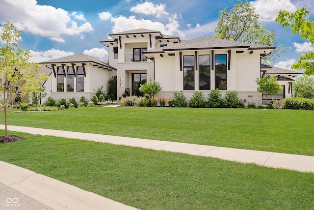 1269 Chatham Rdg Ct, Westfield, IN 46074 - view of front facade featuring a balcony, stucco siding, a front lawn, and stone siding