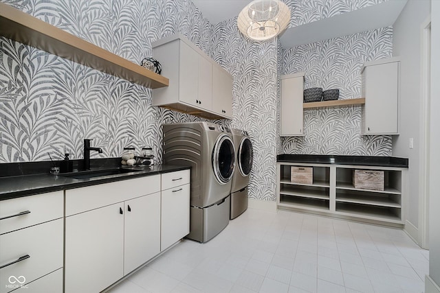 1269 Chatham Rdg Ct, Westfield, IN 46074 - laundry room with wallpapered walls, washing machine and dryer, cabinet space, and light tile patterned floors