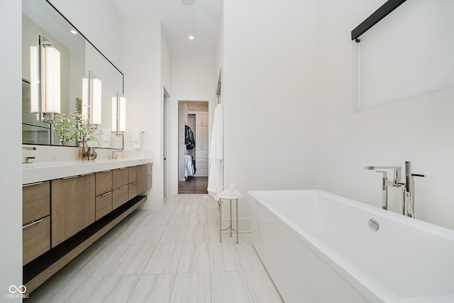 1269 Chatham Rdg Ct, Westfield, IN 46074 - full bath featuring a soaking tub, double vanity, tile patterned flooring, and recessed lighting