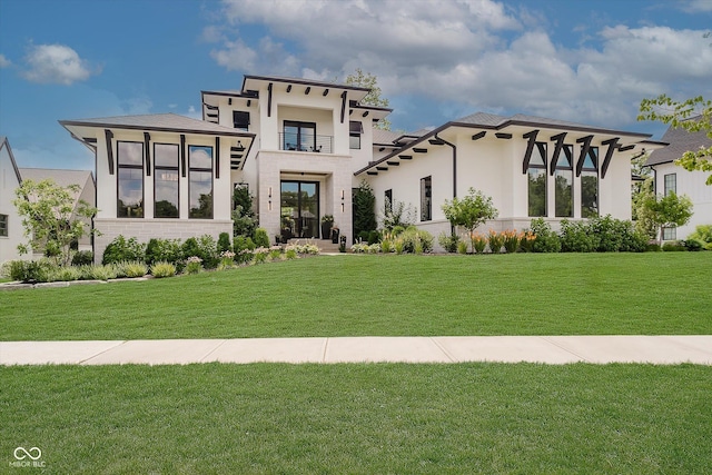 1269 Chatham Rdg Ct, Westfield, IN 46074 - view of front facade with a front yard, stucco siding, and a balcony