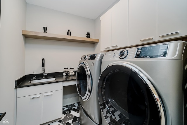 1269 Chatham Rdg Ct, Westfield, IN 46074 - laundry area featuring independent washer and dryer, cabinet space, and tile patterned floors