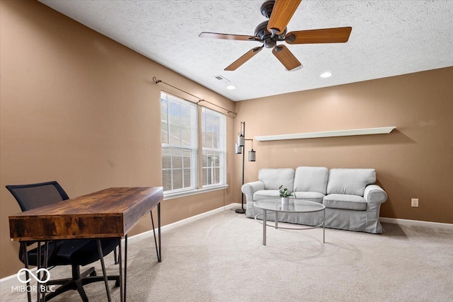 143 W Clear Lake Ct, Westfield, IN 46074 - living area featuring a textured ceiling, carpet flooring, and a ceiling fan