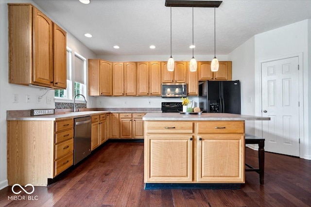 143 W Clear Lake Ct, Westfield, IN 46074 - kitchen featuring appliances with stainless steel finishes, light countertops, dark wood-style flooring, pendant lighting, and recessed lighting