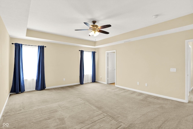 14095 Northcoat Pl, Fishers, IN 46038 - empty room featuring ceiling fan, light carpet, a raised ceiling, and a smoke detector