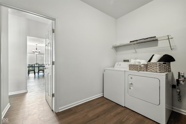 12404 Titans Dr, Fishers, IN 46037 - washroom featuring wood finished floors, washer and clothes dryer, and a chandelier