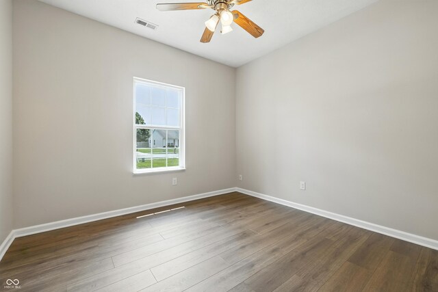 12404 Titans Dr, Fishers, IN 46037 - spare room featuring ceiling fan and dark wood-type flooring