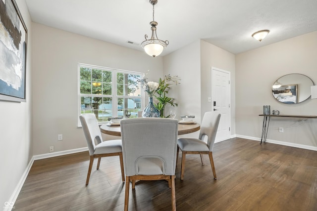 12404 Titans Dr, Fishers, IN 46037 - dining area featuring dark wood-style floors and baseboards