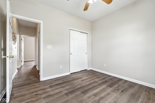 12404 Titans Dr, Fishers, IN 46037 - unfurnished bedroom featuring dark wood-type flooring, a closet, and ceiling fan